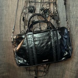 Rebbeca Minkoff 14W x 8H cross body purse. Color is black with silver zippers.